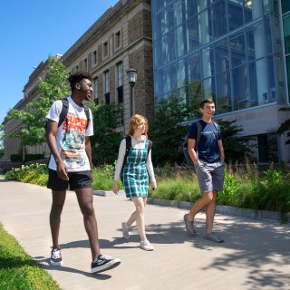 Three students walking on a warm summer day